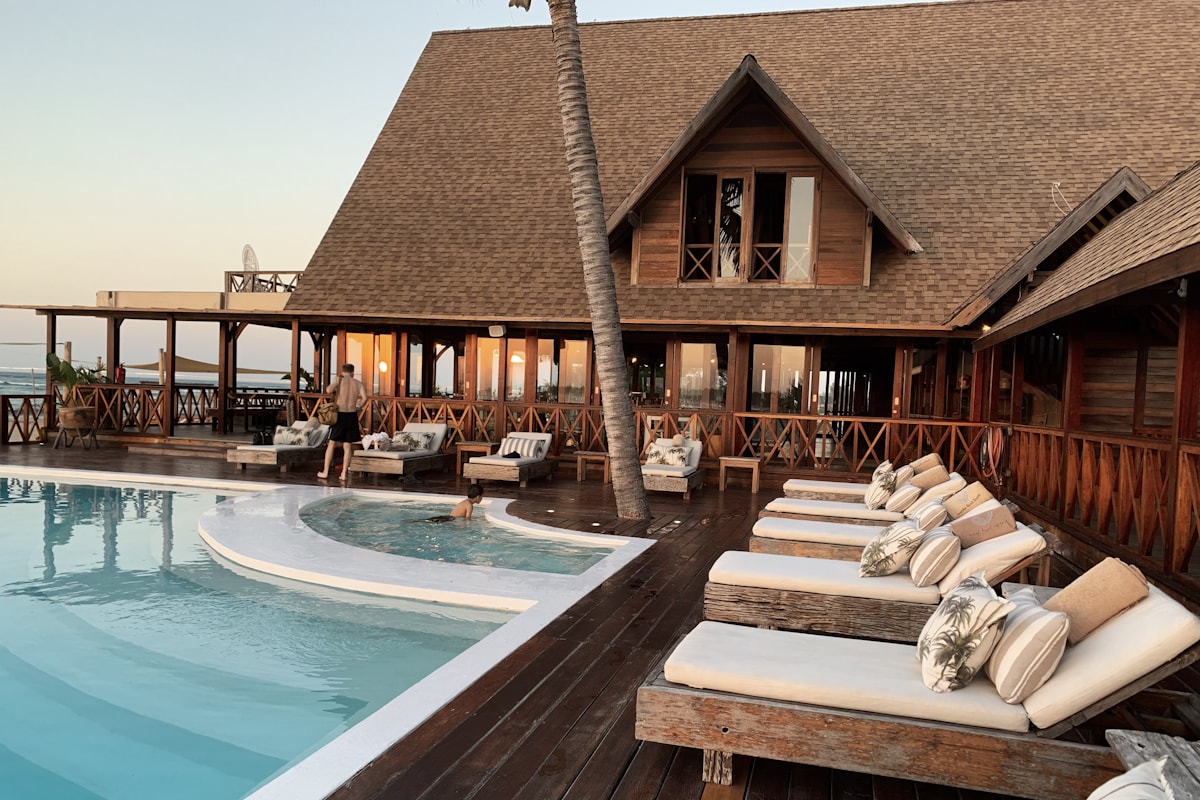 Boutique hotel concierge and guest reviewing travel plans